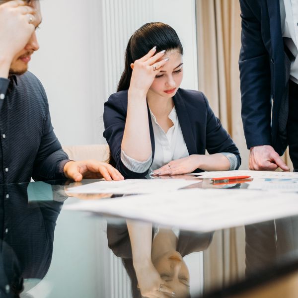People pondering some documents