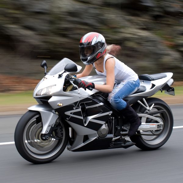 Woman writing a motorcycle 