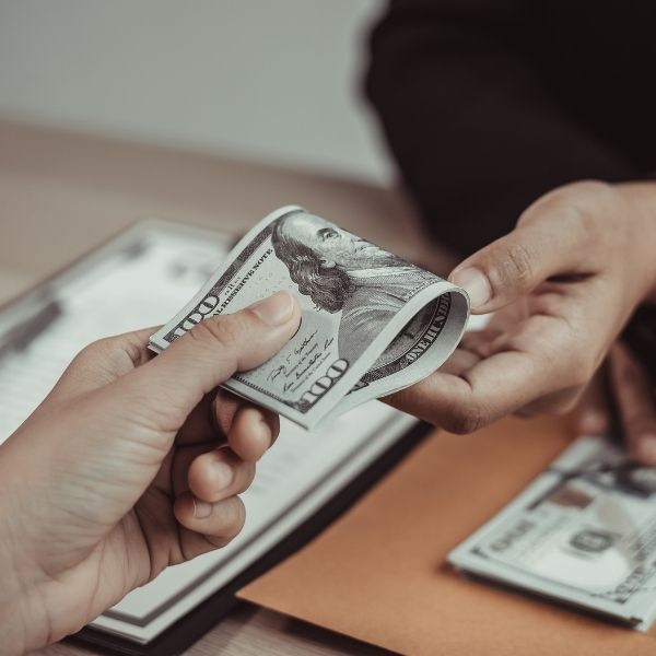 handing over cash