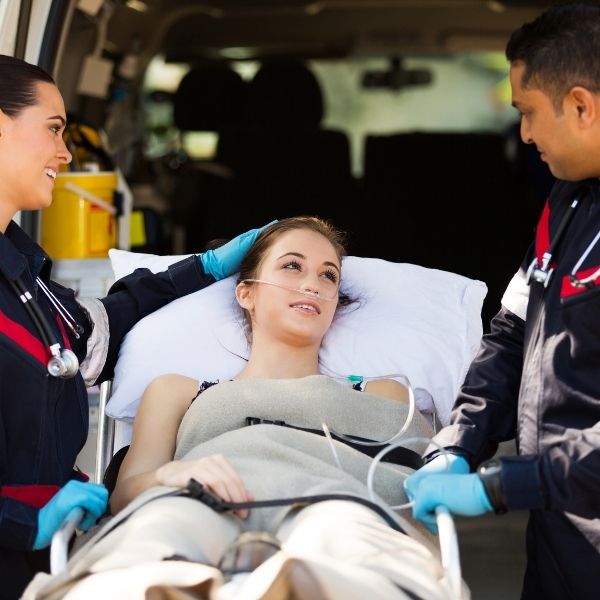 A woman being treated by EMTS