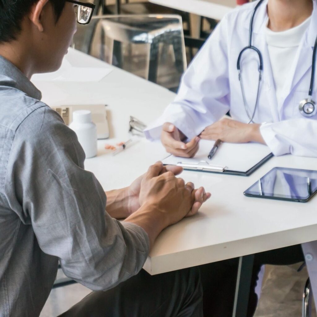 A man speaking with his doctor