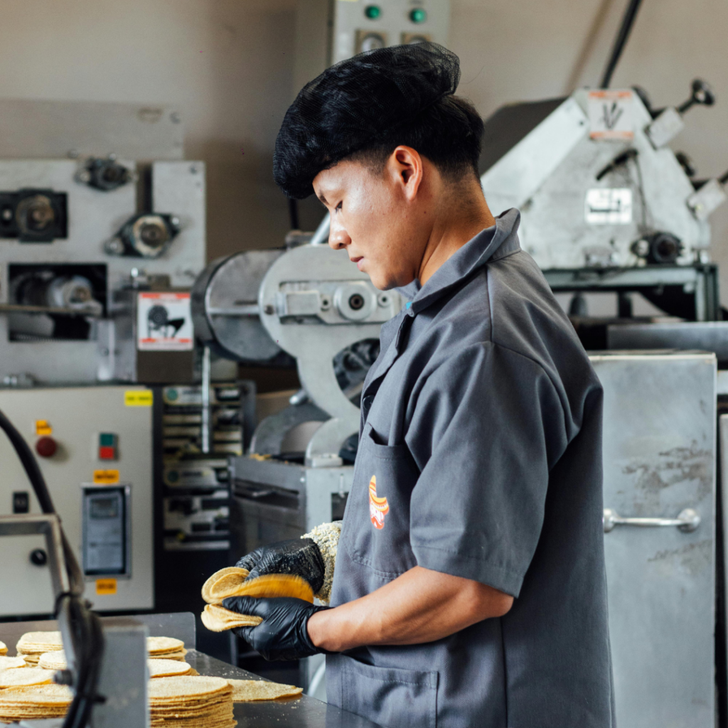 A man working at a tortilla factory