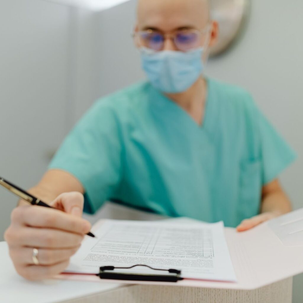 A doctor looking at documents