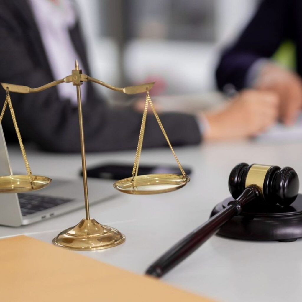 A juge gavel next to lawyers