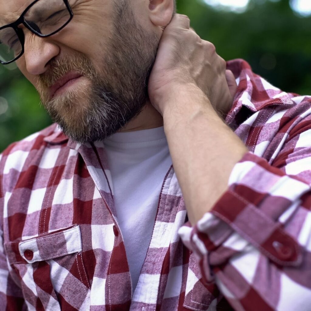 A man with a hurt neck