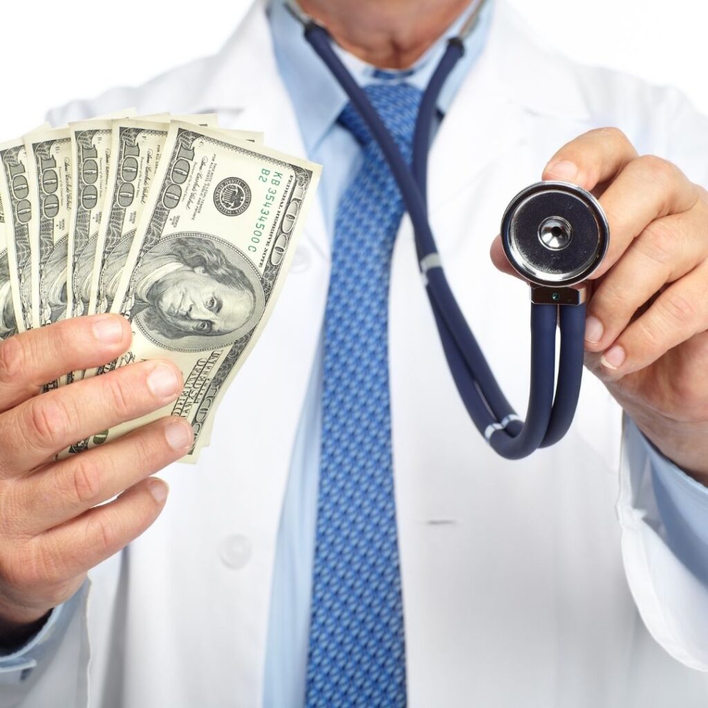 A doctor holding money