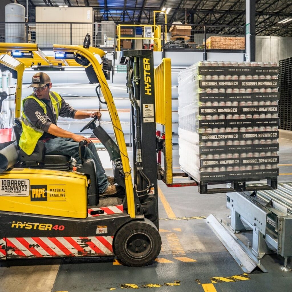 person driving forklift