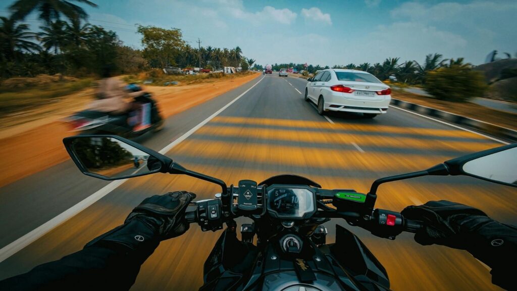 motorcycle on road with cars