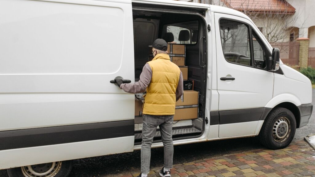 delivery van driver with boxes in van
