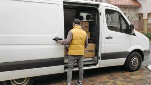 delivery van driver with boxes in van